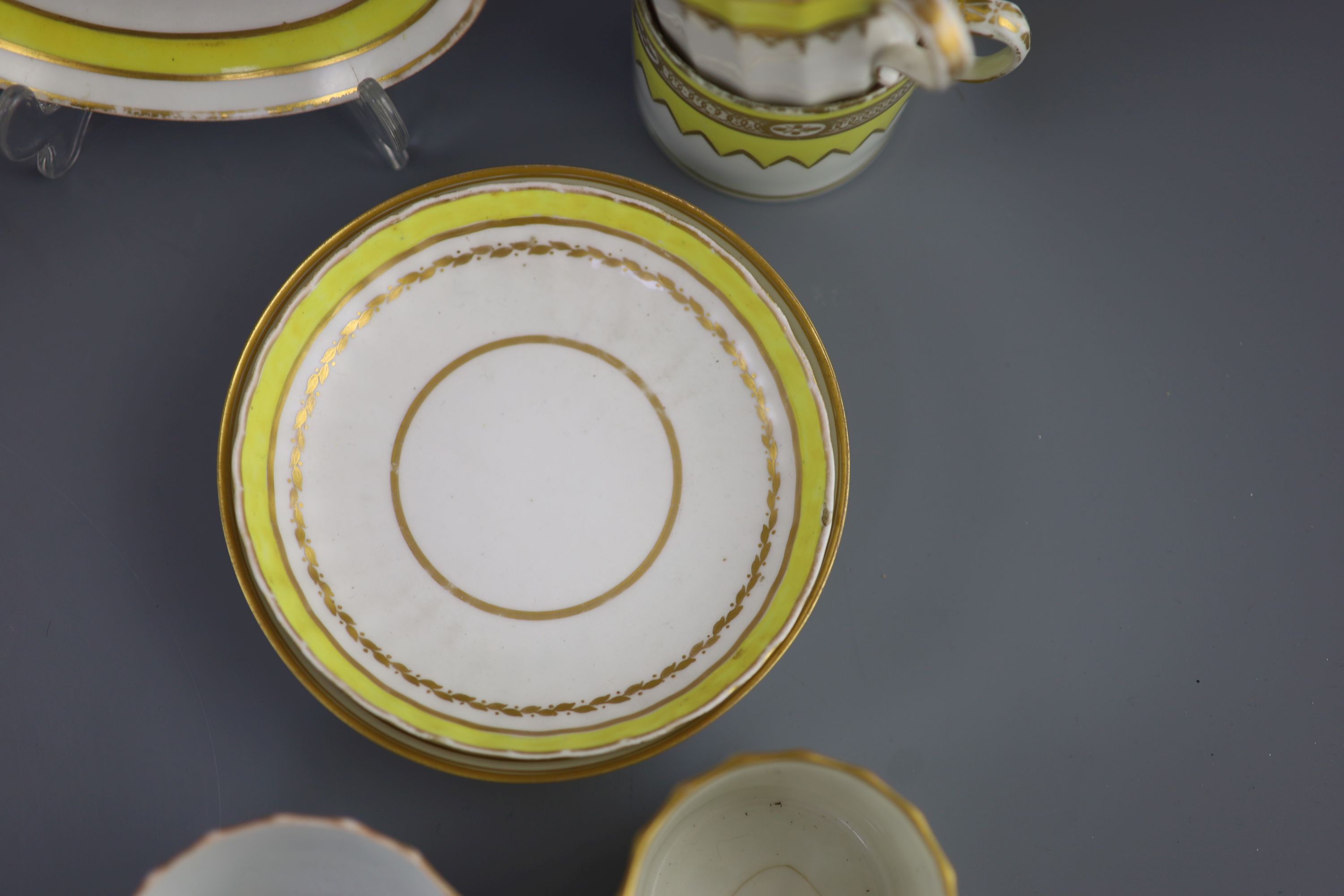 A group of Derby yellow ground tea and coffee wares and a chamberstick, c.1790-1800